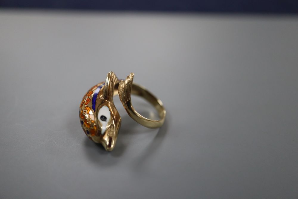 A moder 585 yellow metal and enamelled dolphin ring, size L, gross 5.6 grams.